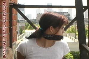 Alternative view of Asian Leah Iron Tied Up on the Fire Escape in Sneakers (4:45 min)
