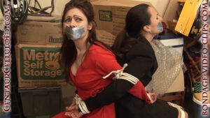 Alternative view of Secretaries Natasha Flade & Julia Faire Kidnapped! Tied Back-to-Back, Tape Gagged, Topless! (FULL HD - 13 min)