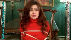 Alternative view of Office Mom Natasha Flade Chairtied in Sweater Bondage for Ransom! Must Get Loose Since No Loot Arrived! (FULL HD - 8:09 min)